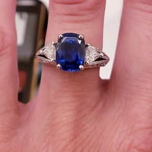 Blue sapphire with side diamond engagement ring